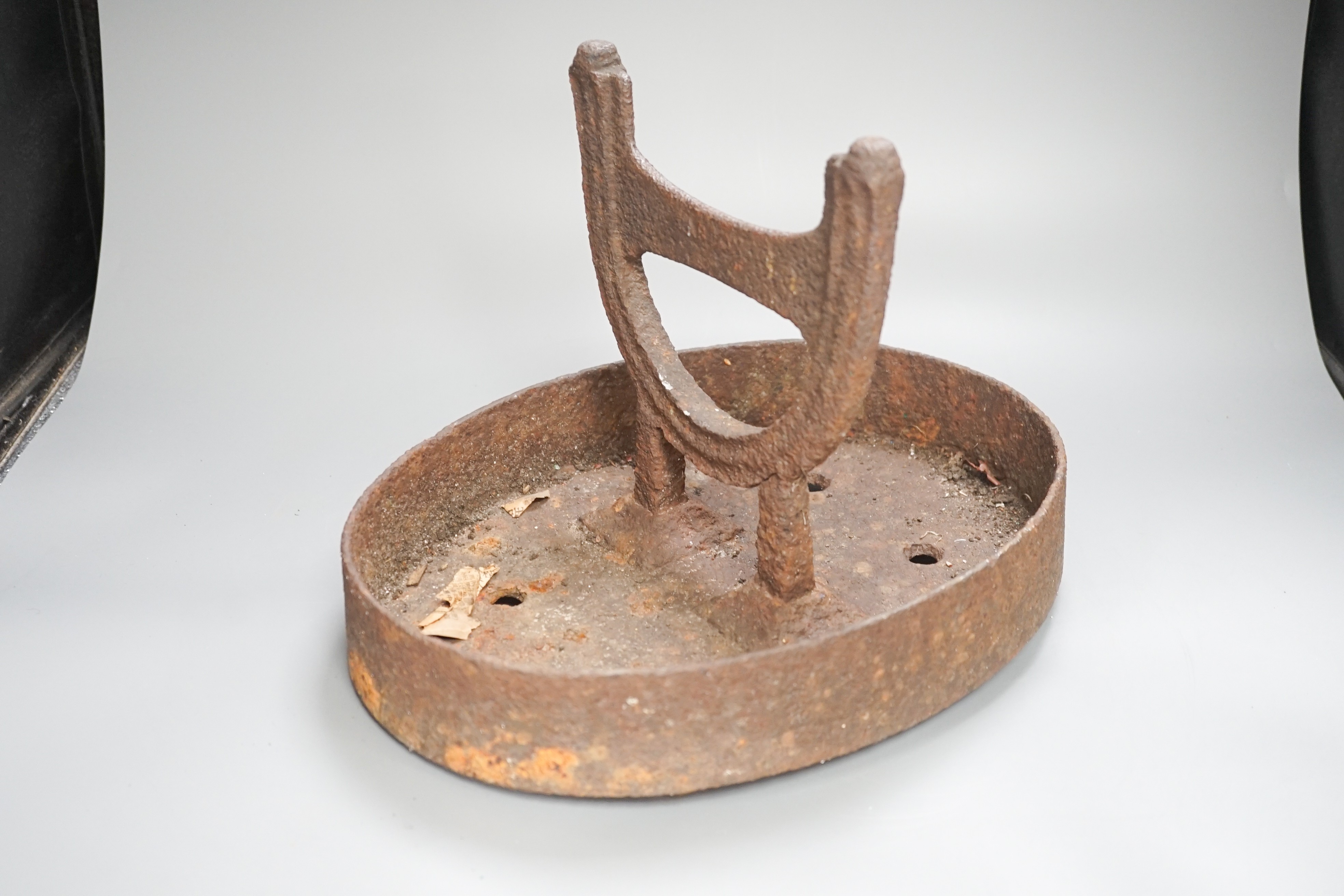 An iron foot scraper